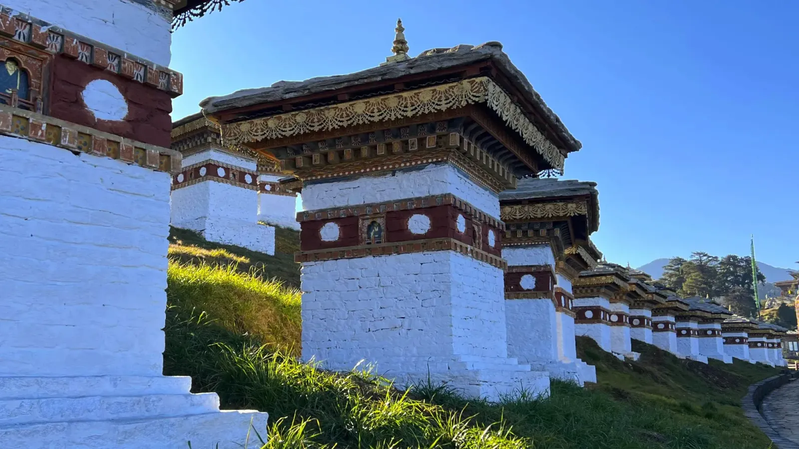 Dochula Pass by Mrs. Wanderer A series of white painted stupas